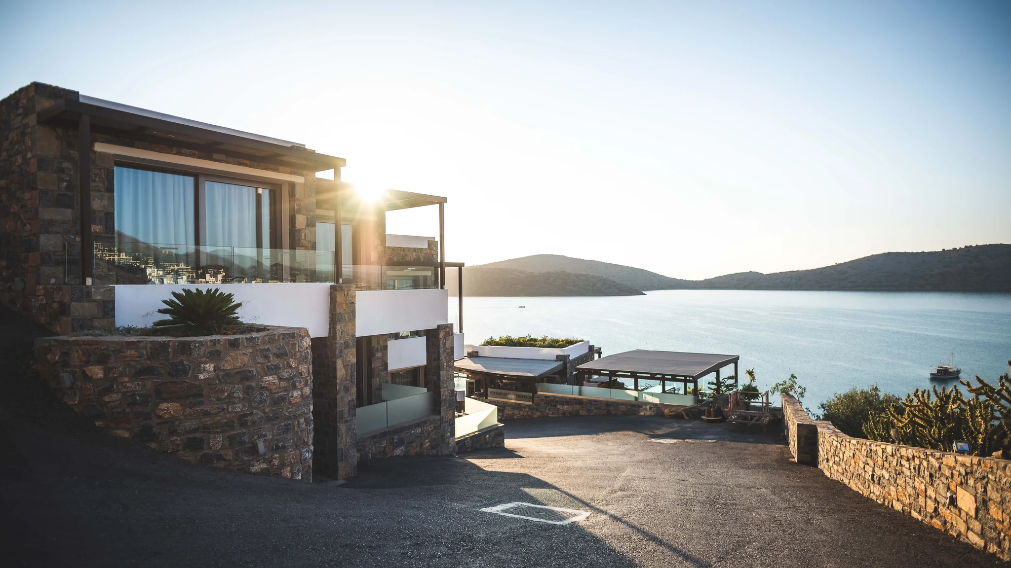Luxury stone residence overlooking a calm waterfront